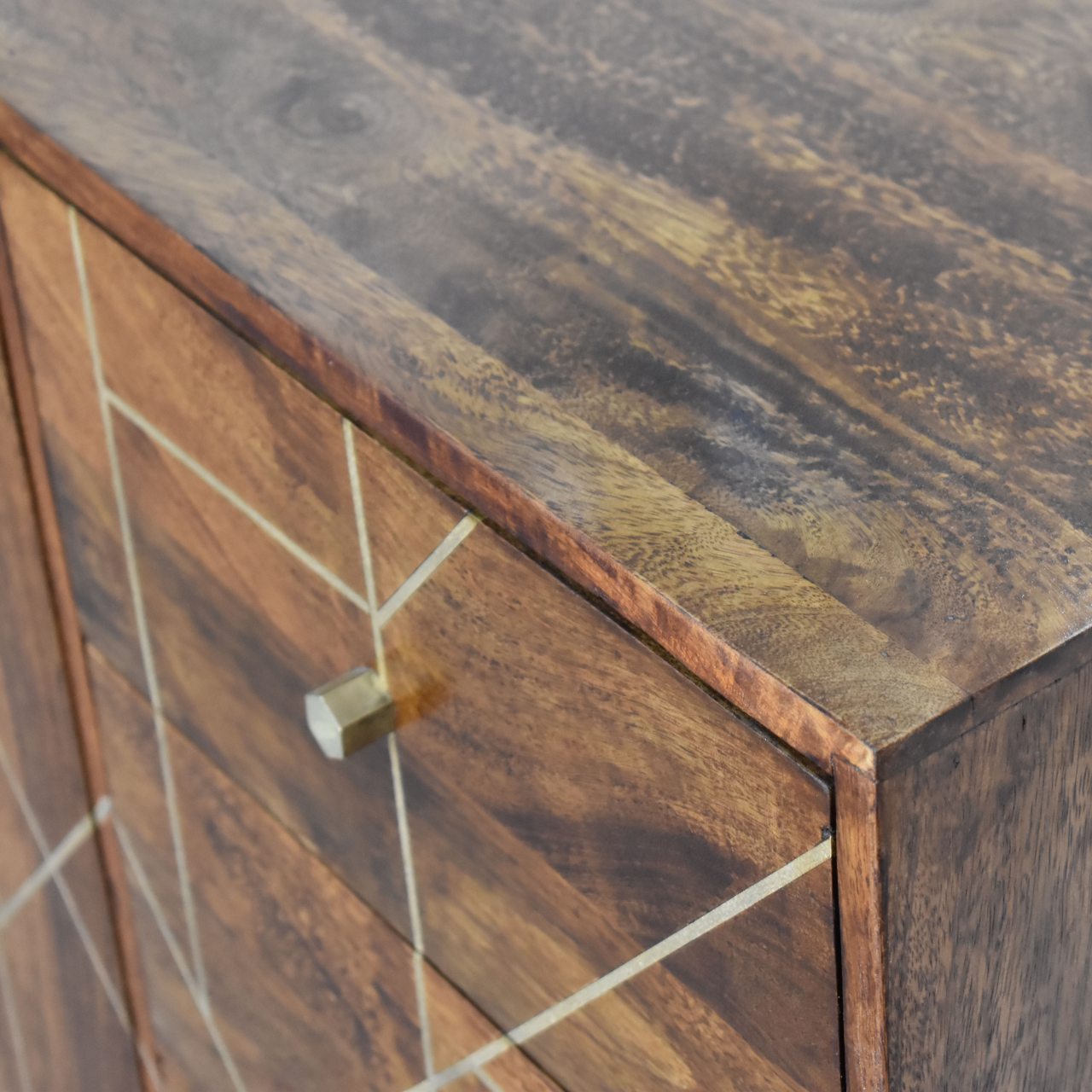 This chestnut gold inlay abstract sideboard is perfect for adding a touch of luxury to your bedroom. The solid wood construction and stylish finish make it a great choice for anyone looking for a high quality piece of furniture, while the abstract design adds a touch of glamour that will really stand out. And with plenty of storage space on offer, this sideboard is ideal for keeping your bedroom organized and tidy.