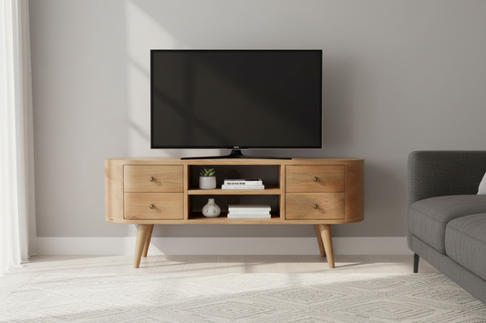 Wooden TV stand with a television mounted on a gray wall, next to a gray sofa.
