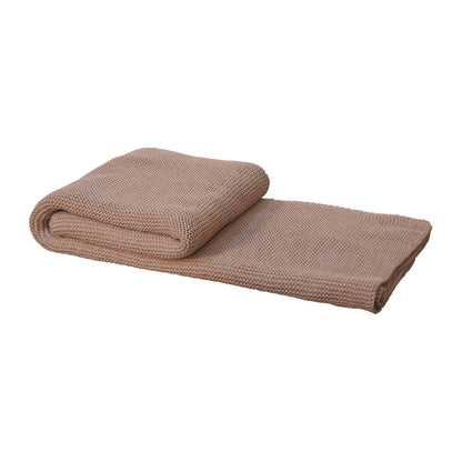 beige knitted throw